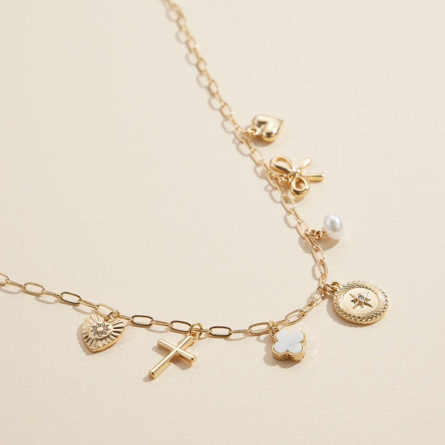 Charm Necklace with Heart, Cross, Compass Pearl, and Bow Pendants