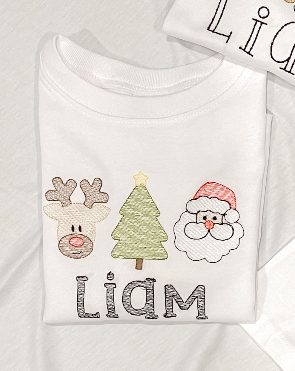 Embroidered reindeer, tree, santa
